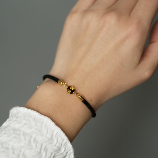 Black bracelet with natural amber