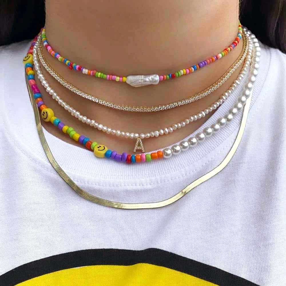 Pärlikee nimetähega. Pärli suuurus 4mm.