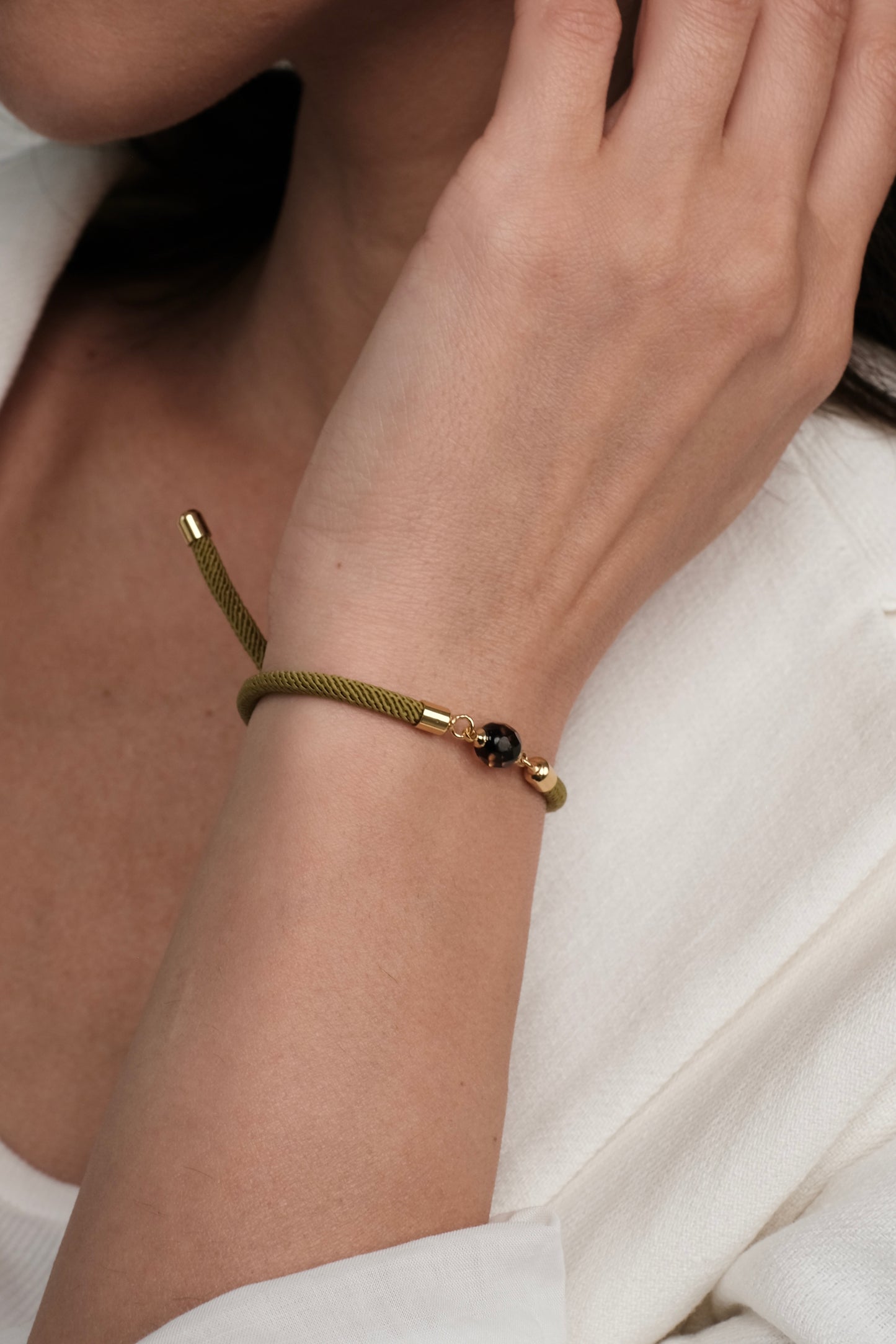 Green bracelet with natural amber