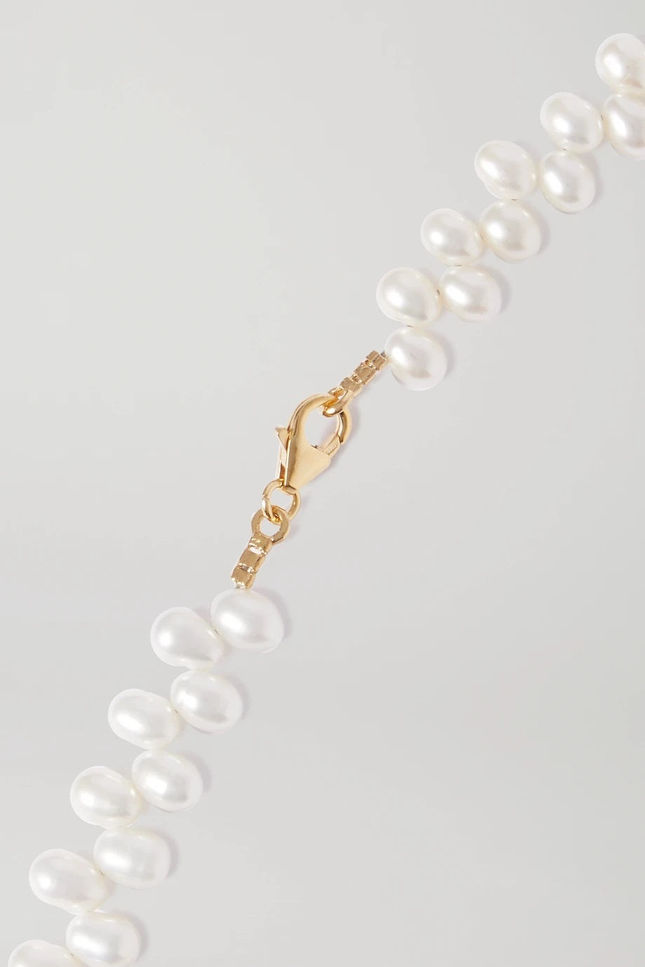 Natural pearl necklace with gold plated sterling silver details