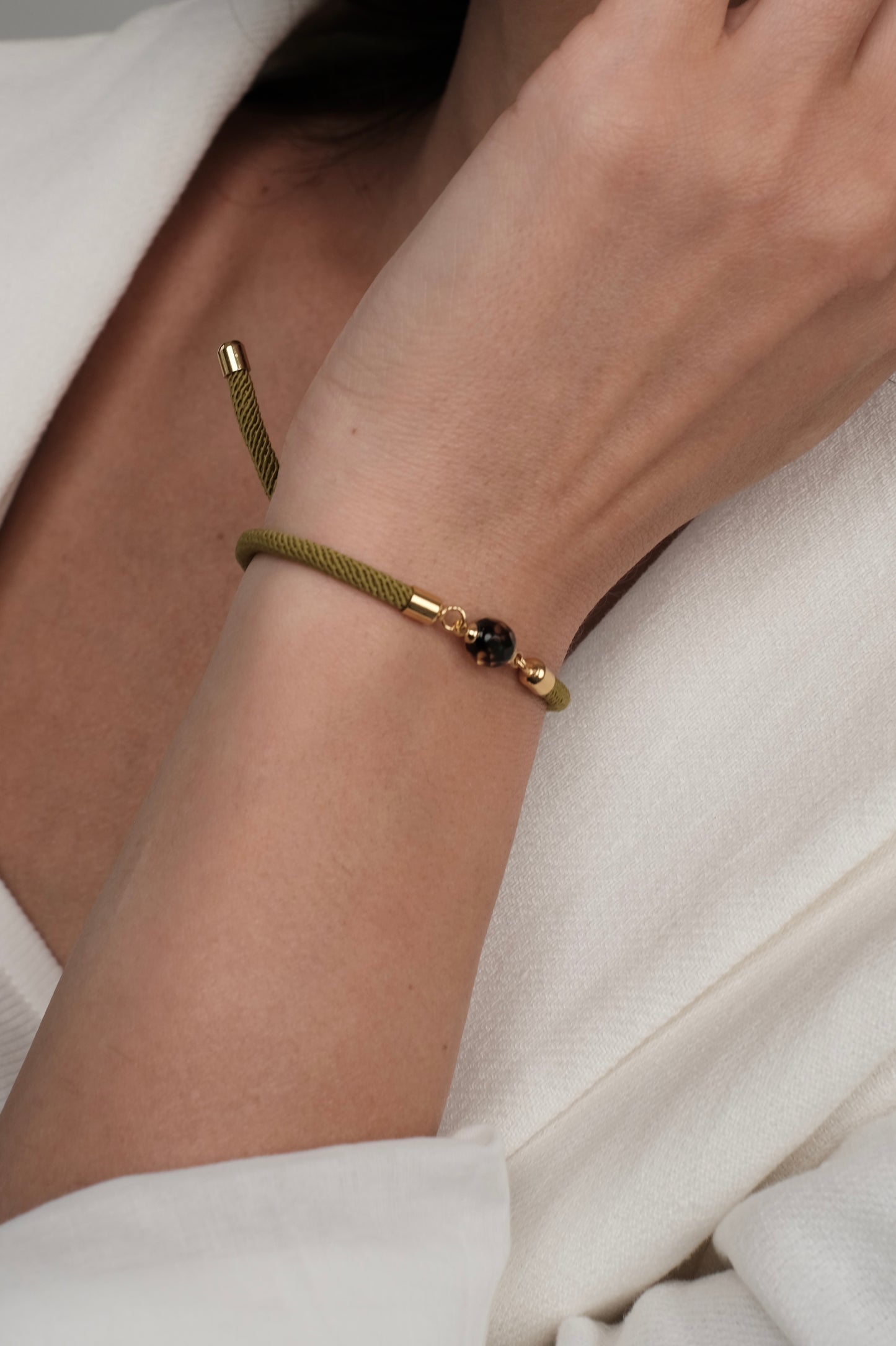 Green bracelet with natural amber