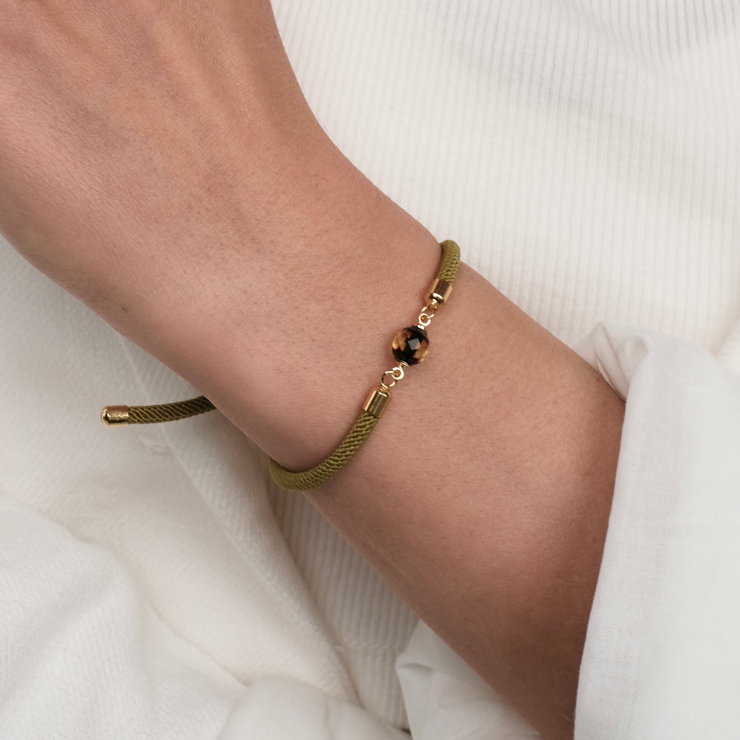 Green bracelet with natural amber