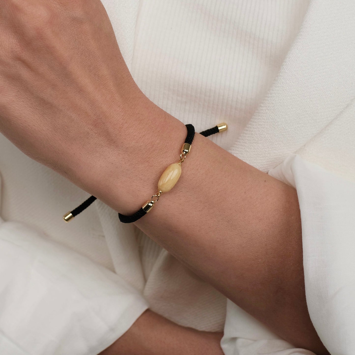Black bracelet with natural amber