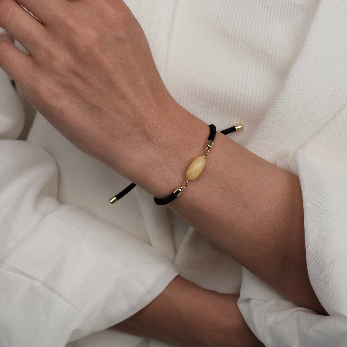 Black bracelet with natural amber