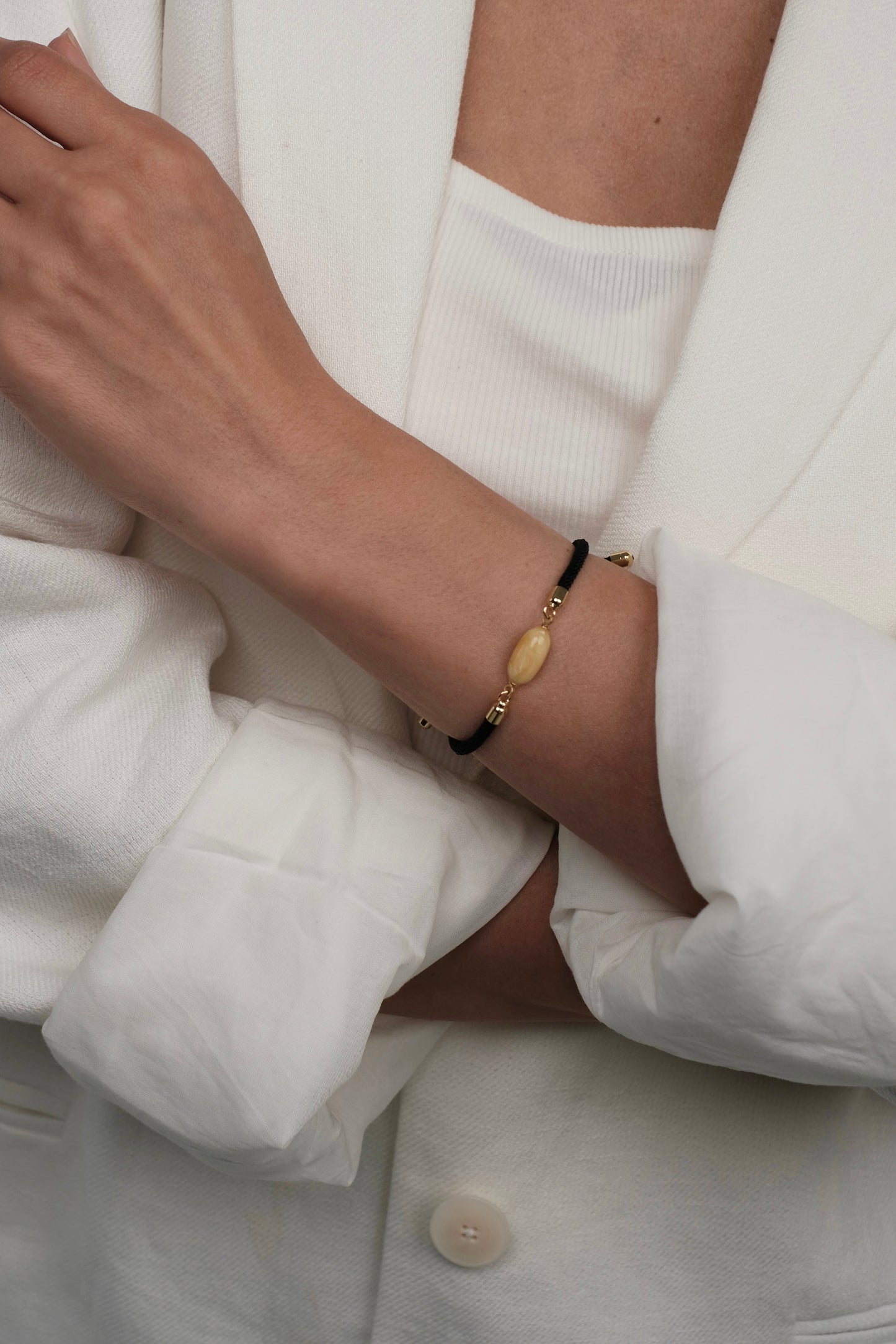 Black bracelet with natural amber