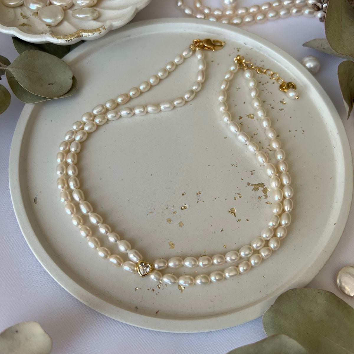 Pärlikee kullatud detailidega "Double love"