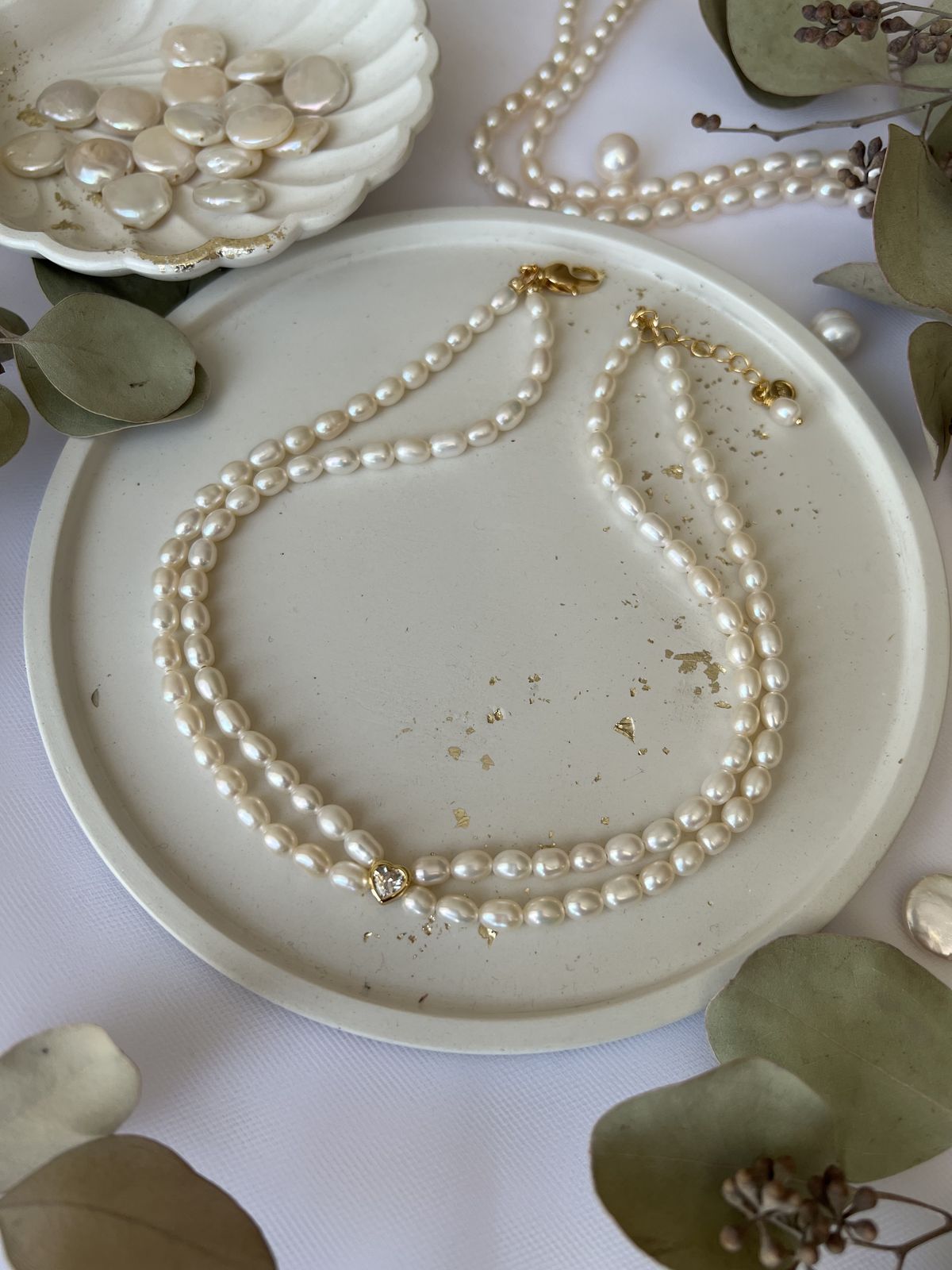 Pärlikee kullatud detailidega "Double love"