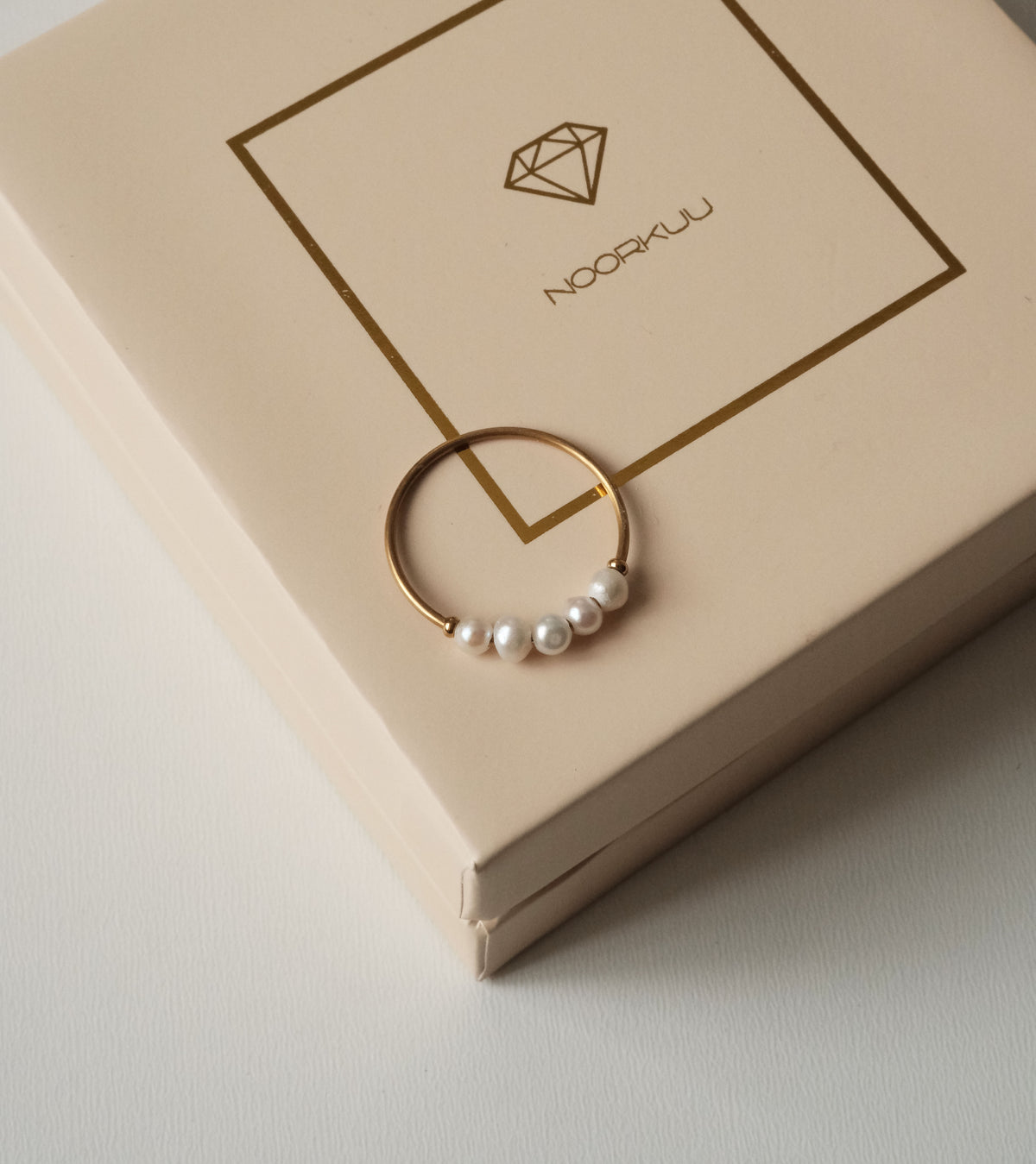 Ring with natural pearls