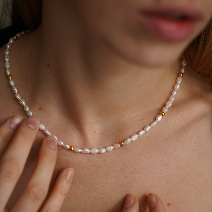 Natural pearl necklace with gold plated details