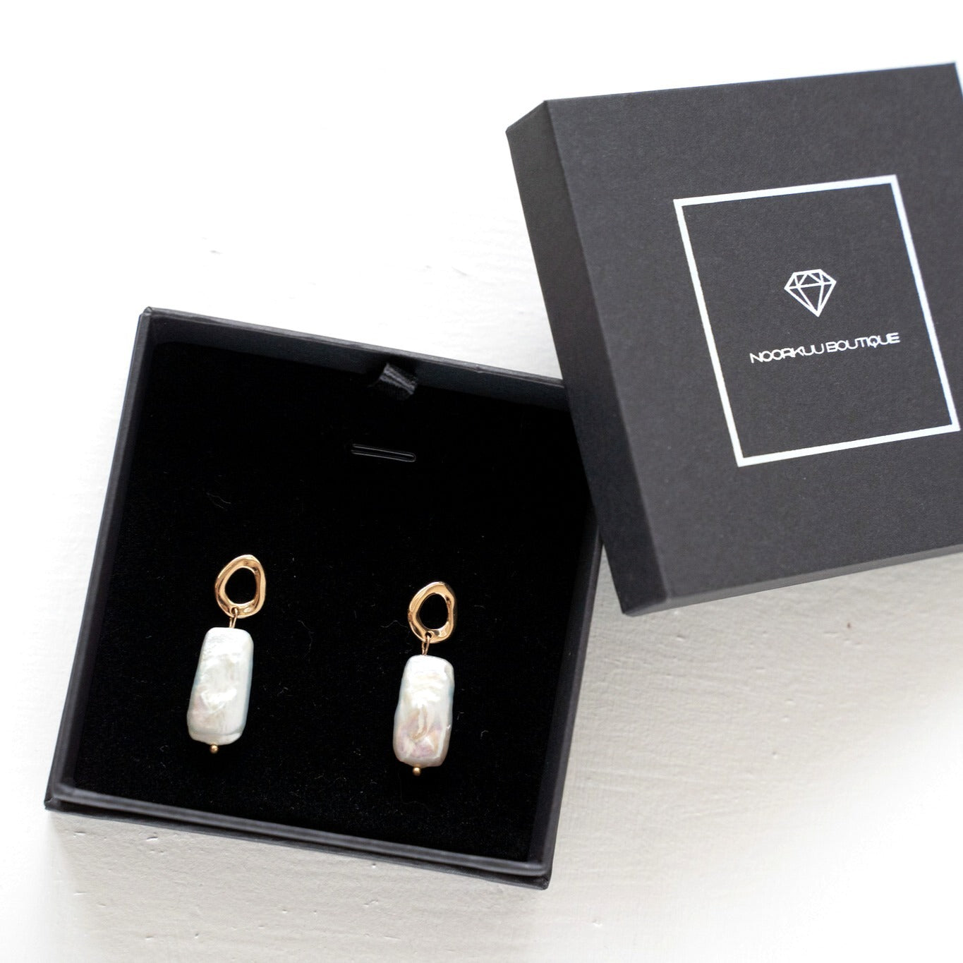 Gold plated earrings with natural baroque pearls